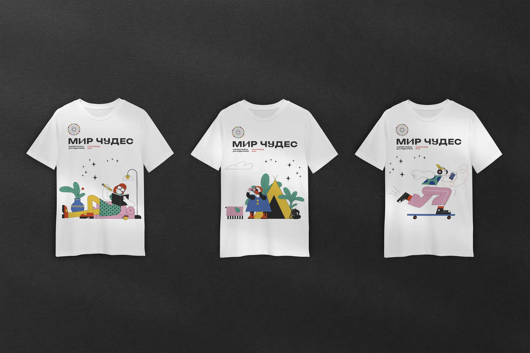 Three white festival T-shirts, each printed with a different illustrated character.